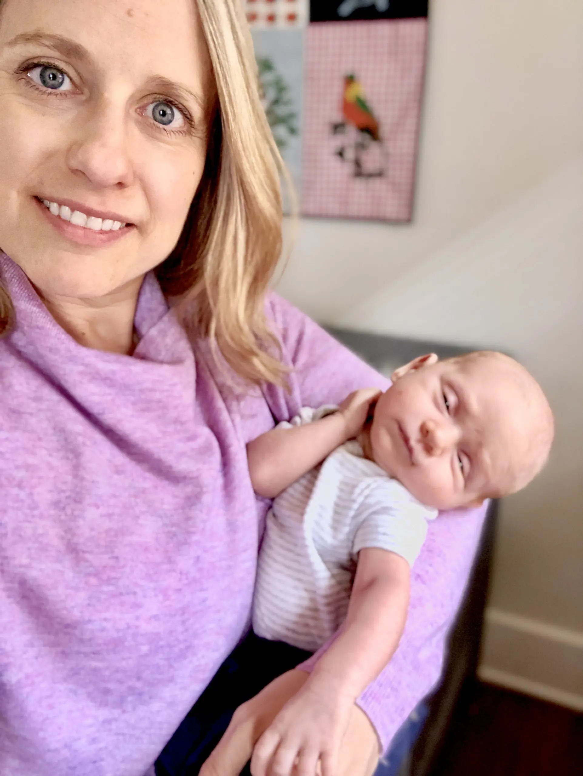 old mom holding a baby