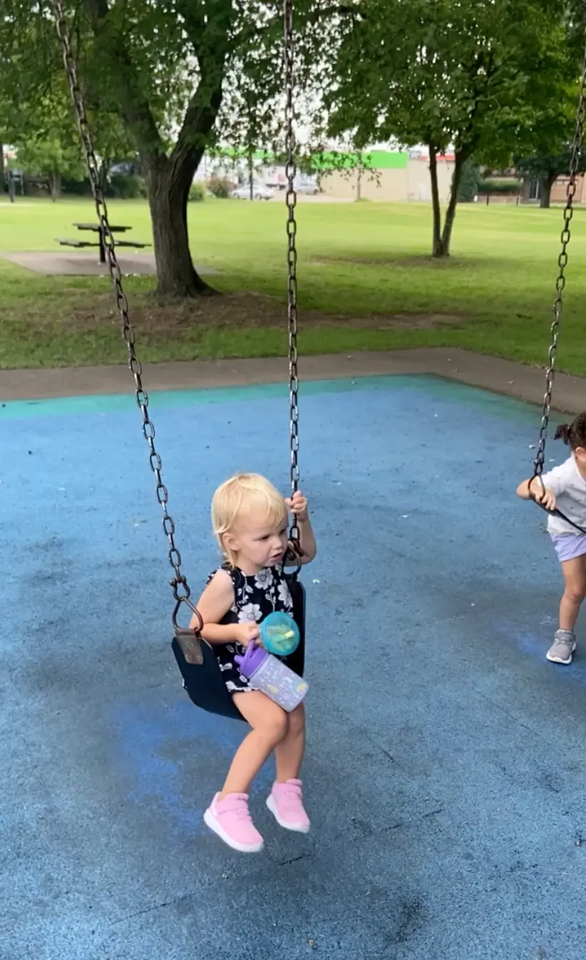 Toddler in swing