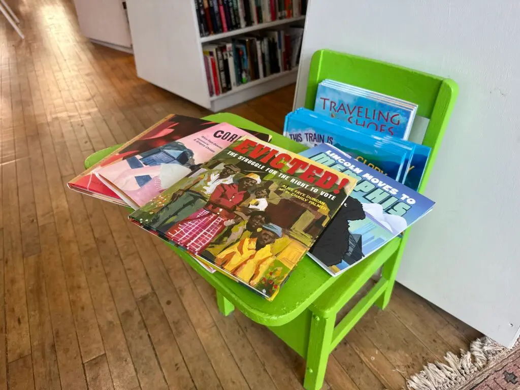 book juggler children's books on a chair