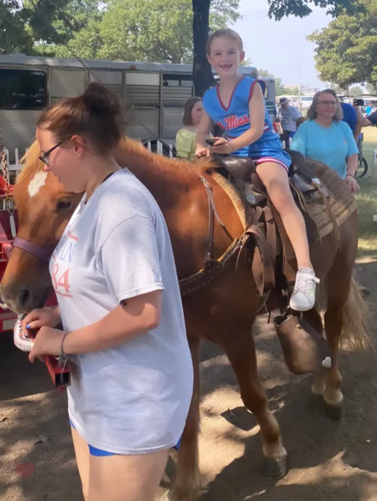 riding a horse at the Pink Palace Crafts Fair