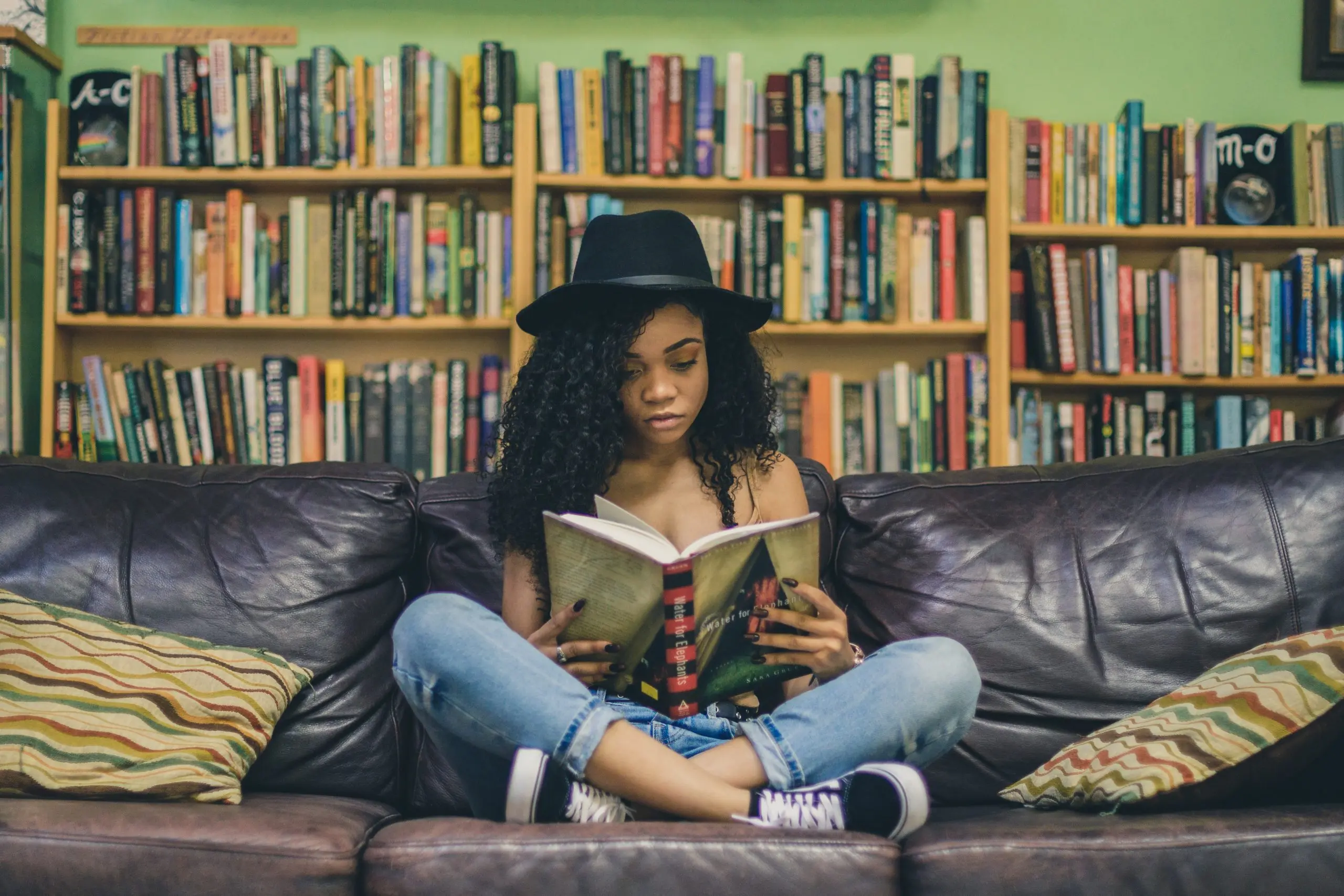 girl reading on a couch