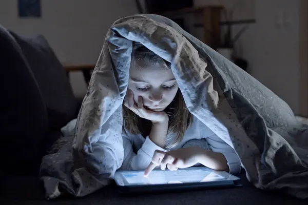 child looking a ipad