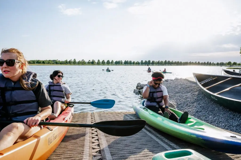 getting into the kayaks and then onto the water