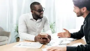 Client talking to an advisor about emergency funds