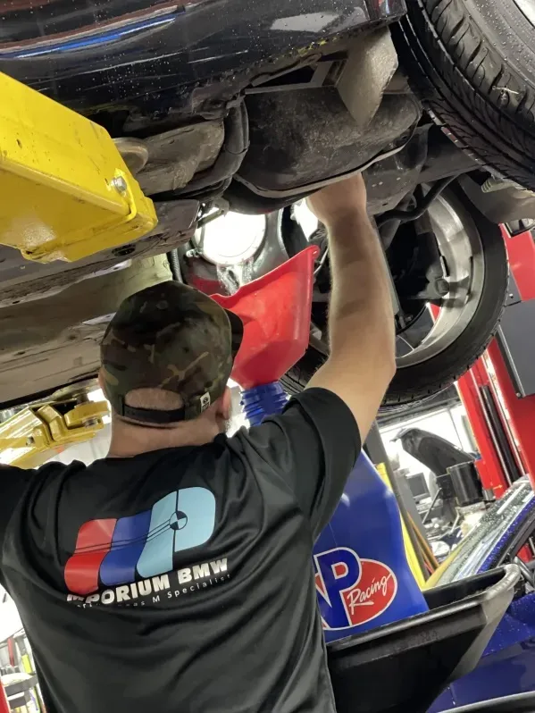 An expert mechanic who understands the soul of the BMW brand performing deep engine diagnostics and repairs for a Collin County client.