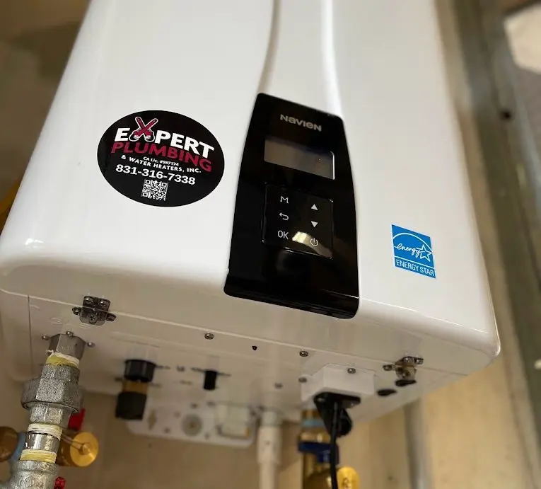 Water heater with Expert Plumbing logo sticker