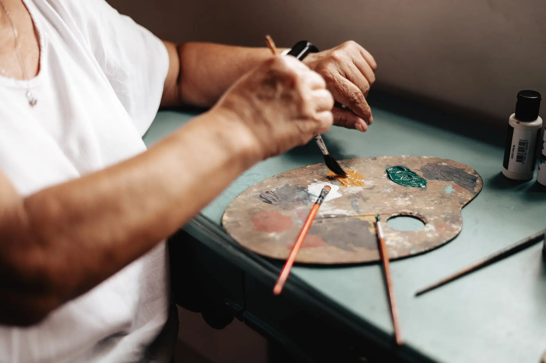 senior artist painting in buenos aires studio