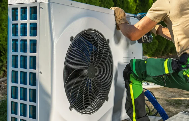 hvac-worker-installing-electric-heat-pump