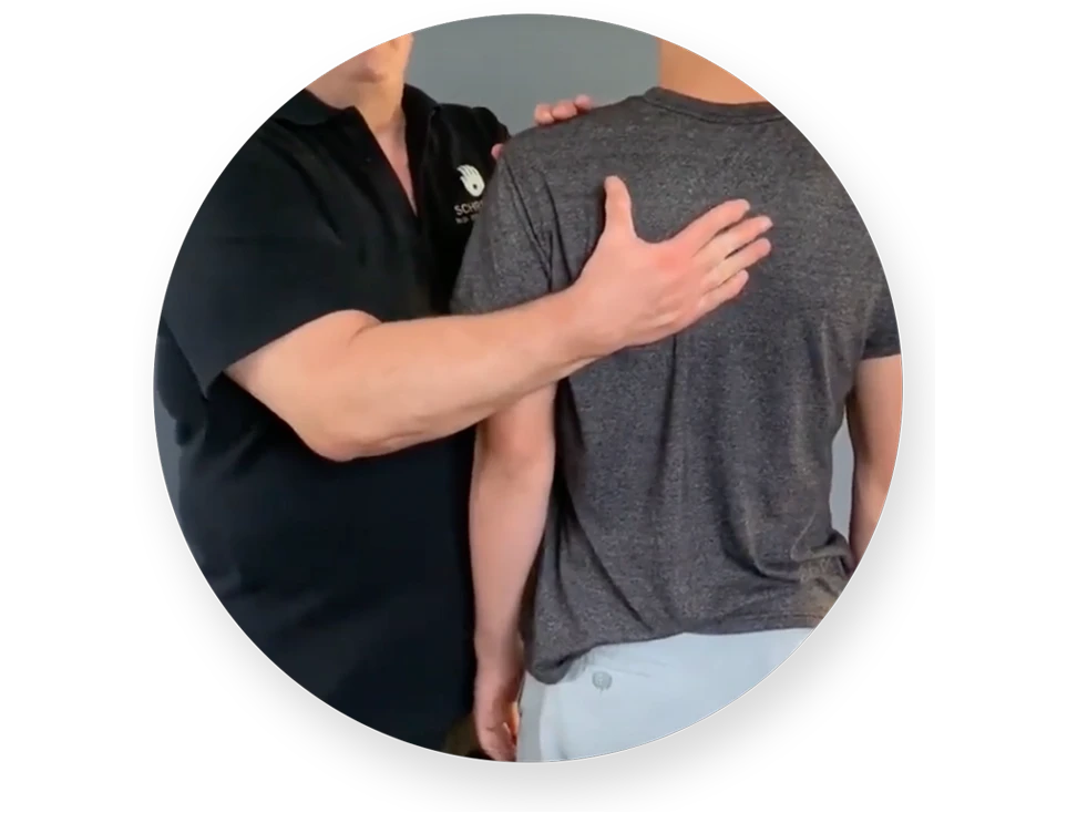 john explaining back pain standing assessment
