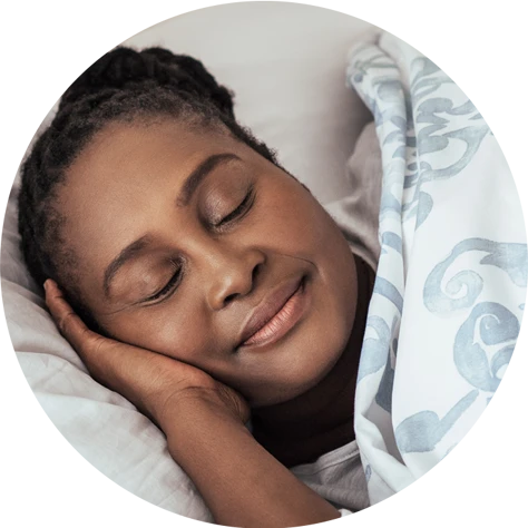 woman sleeping comfortably with her head on the best rest pillow