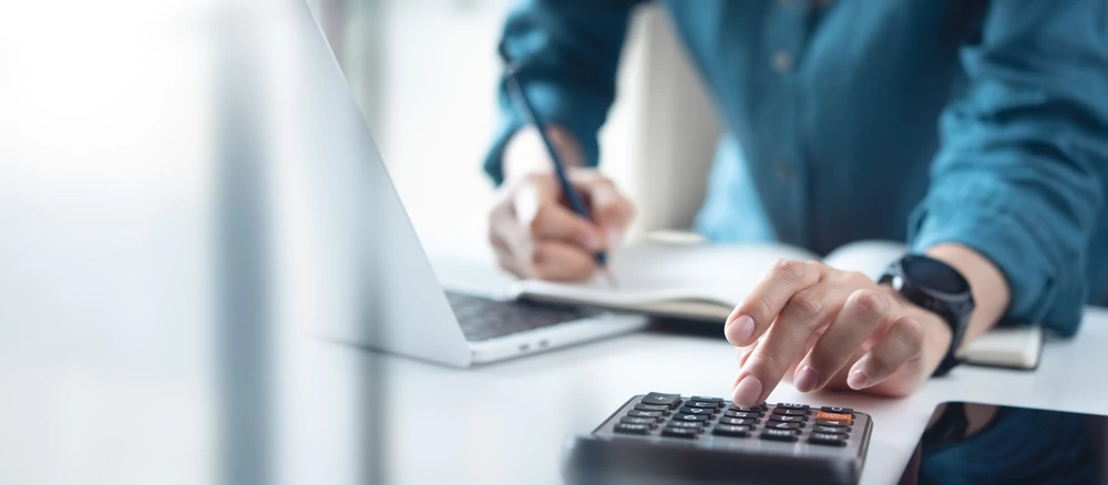 Man calculating financing costs