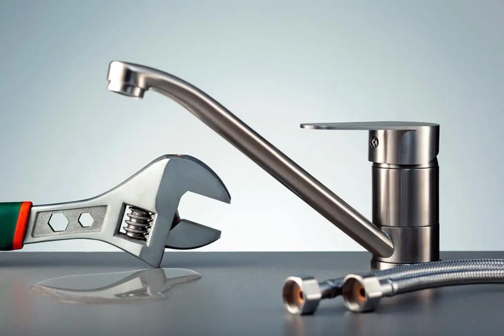 Water leak at faucet. Concept repair water tap.