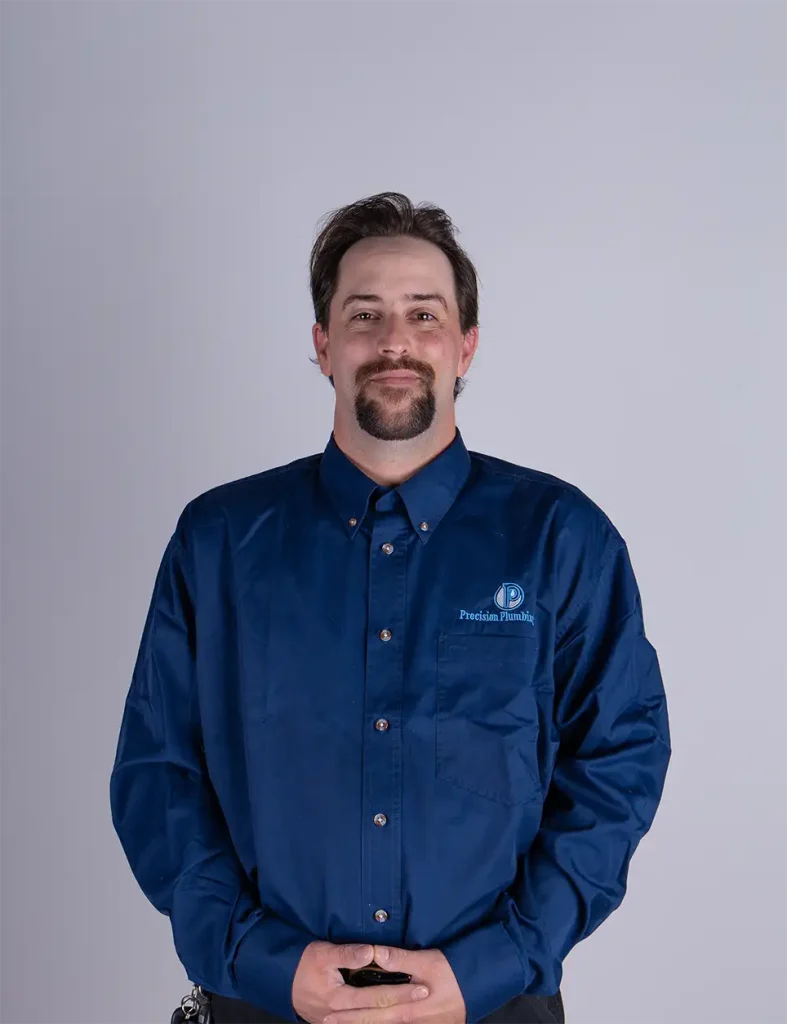 Member of the Precision Plumbing Staff smiling