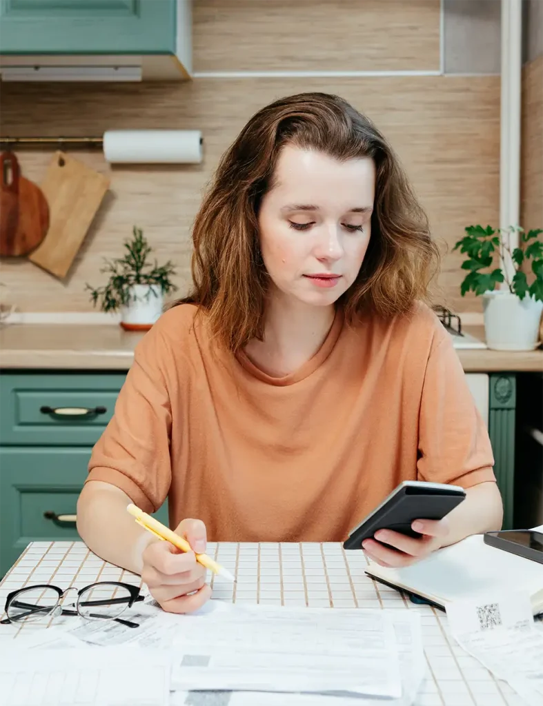 Woman calculating costs and savings