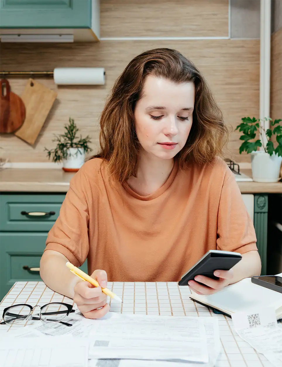 Woman calculating costs and savings