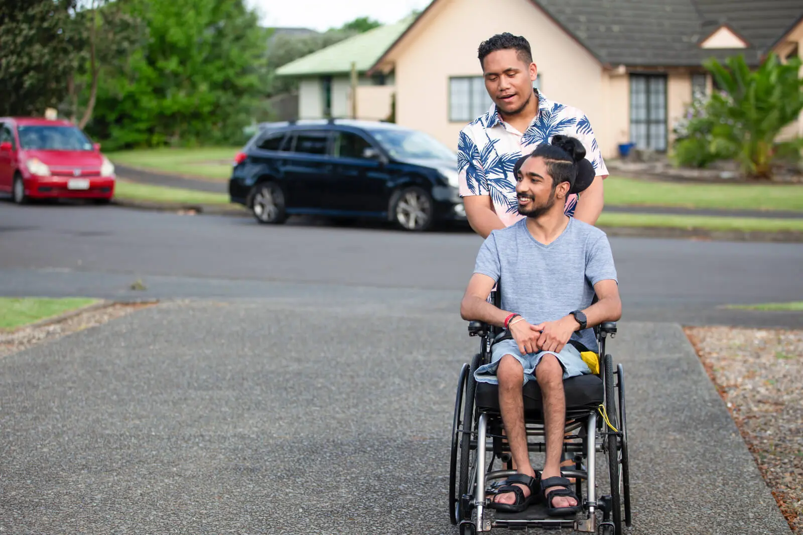 Men in Wheelchair going along street