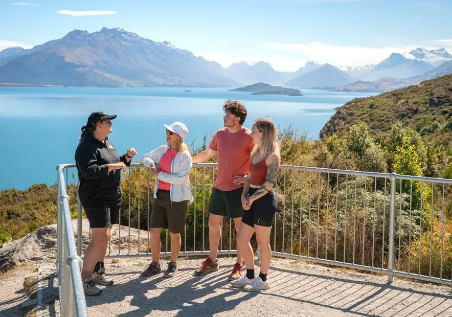 Guide talking with guests at the Bennetts Bluff lookout above Lake Wakatipu