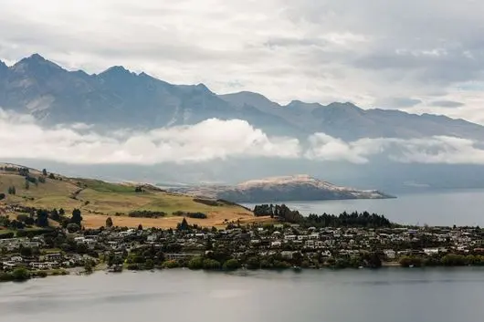 Lake Wakatipu and The Remarkables near Queenstown, with low cloud on the mountains
