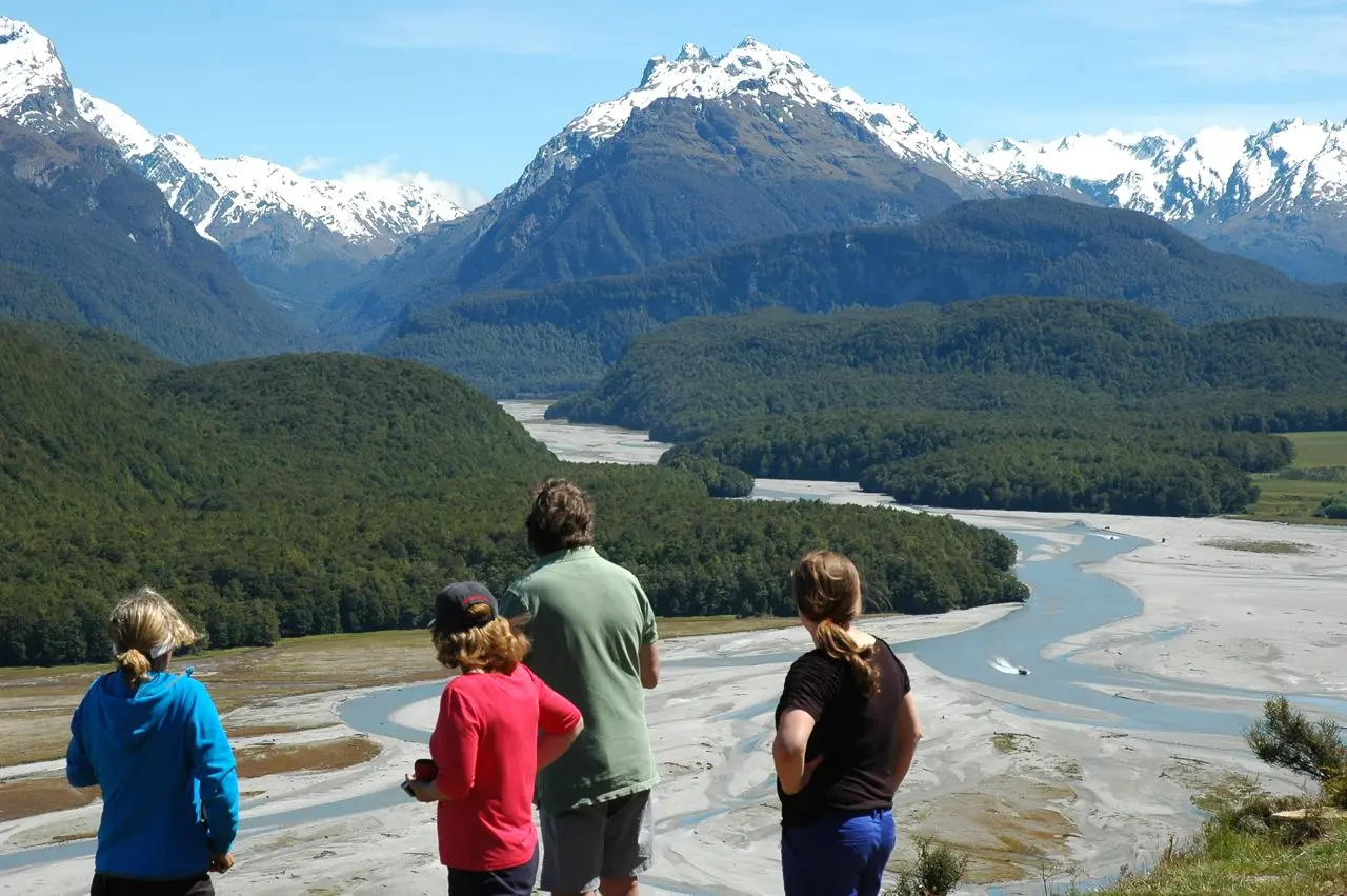 Group admiring mountain river landscape
