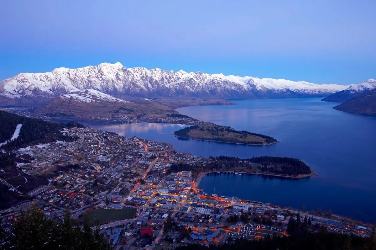 Queenstown at dusk below the snow-covered Remarkables
