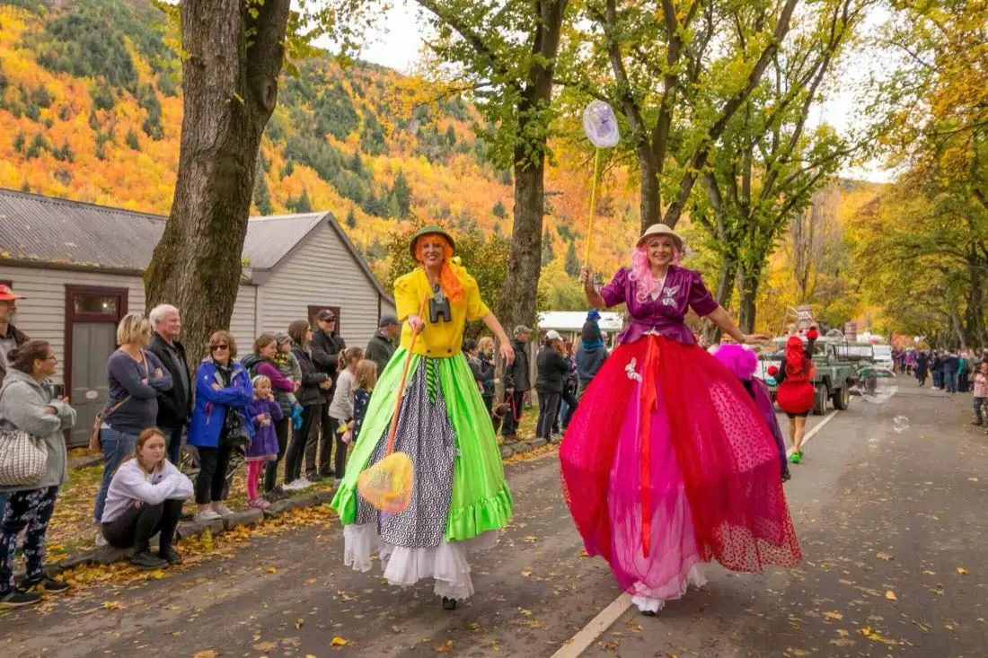 Stilt walkers in the parade at the Arrowtown Autumn Festival