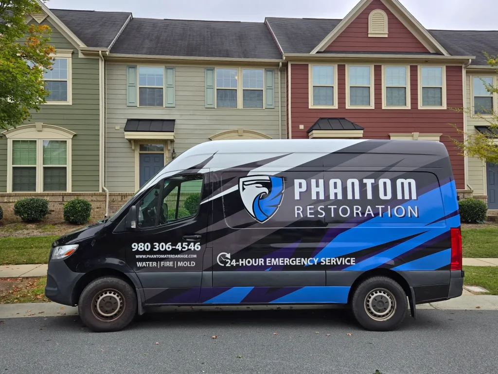 Water Damage Restoration Company Car of Phantom Restoration Representing Phantom Logo