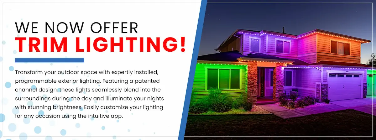 Programmable Trimlight exterior trim lighting glowing in multiple colors on a home at night