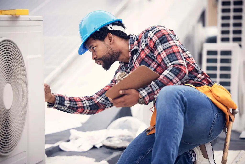 hvac installation Technician, clipboard or air conditioning inspection on rooftop for safety, power or maintenance. Electrician, black man or paperwork on hvac system, ac repair or quality assurance for sustainability.