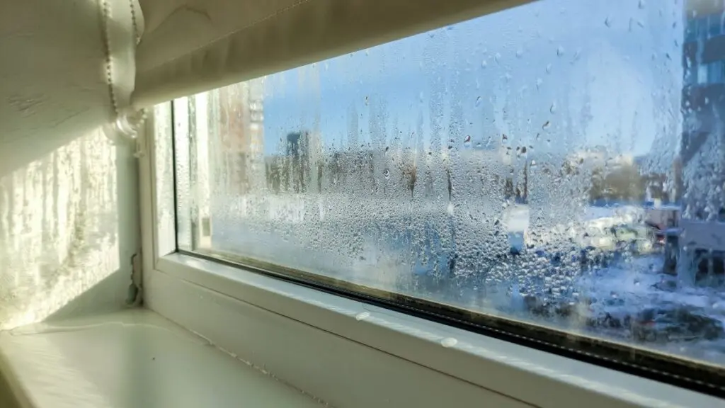 Drops of condensation on a poor-quality PVC window