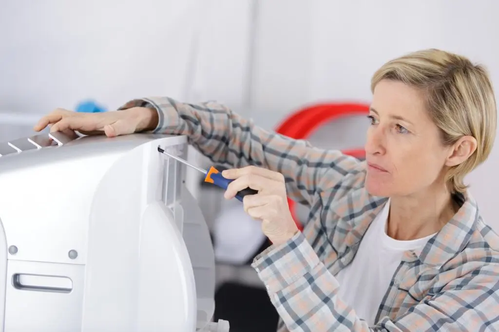 hvac installation blonde handywoman cleaning fixing ventilation system