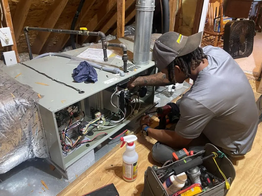 Panther HVAC technician working on AC maintenance
