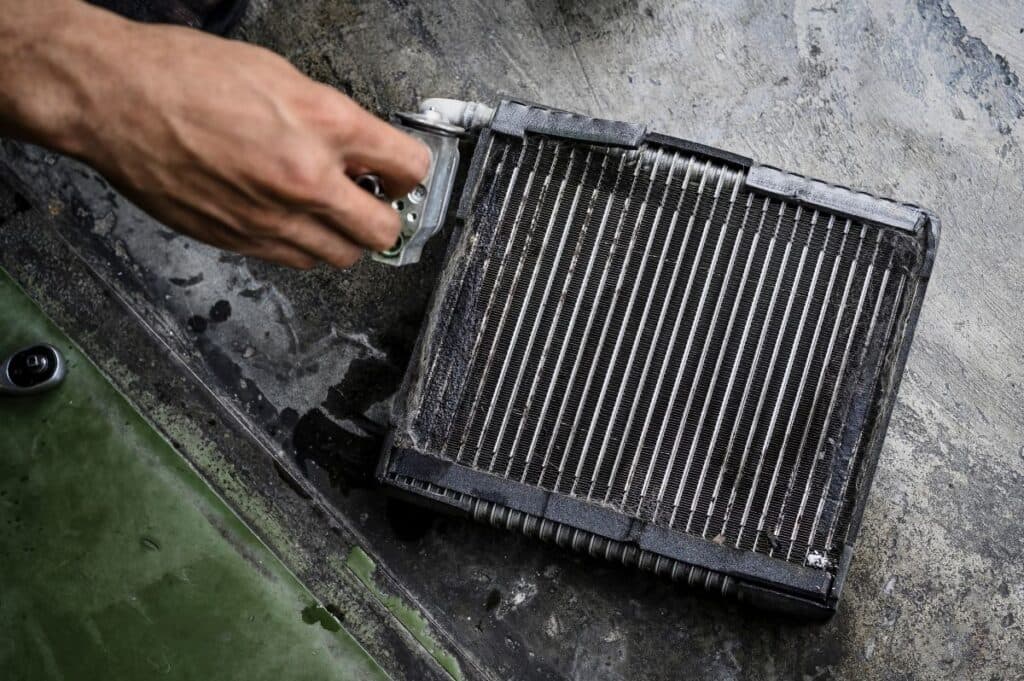 Close-up of car air conditioning evaporator coil leaks