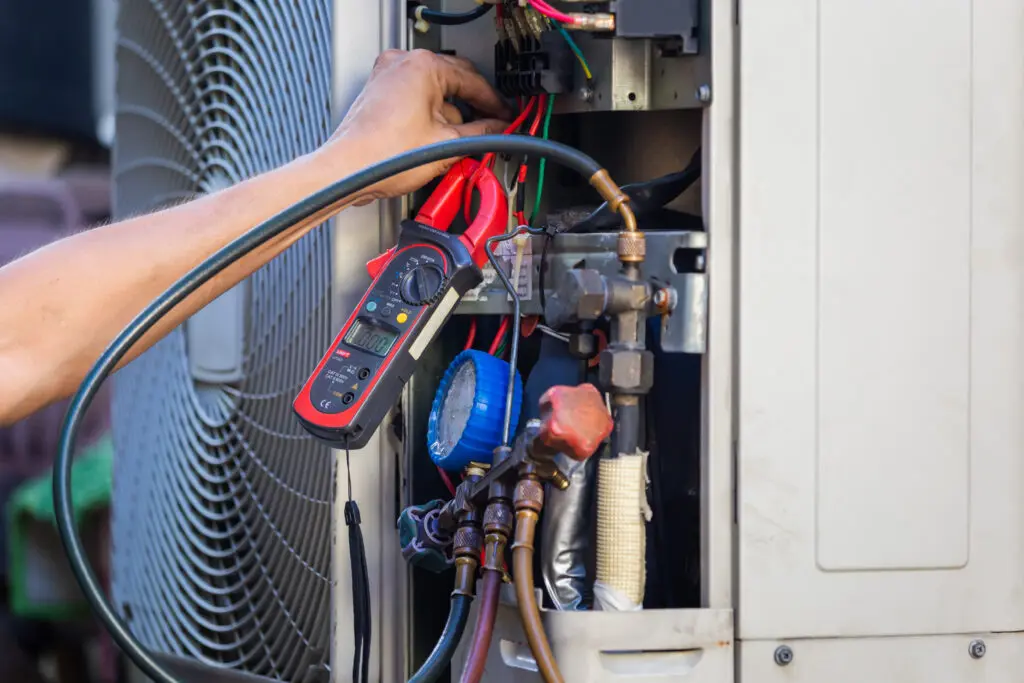 Air Conditioning Repair man hands checking and fixing modern air conditioning system, Technician team checking leakage air conditioning system hvac repair