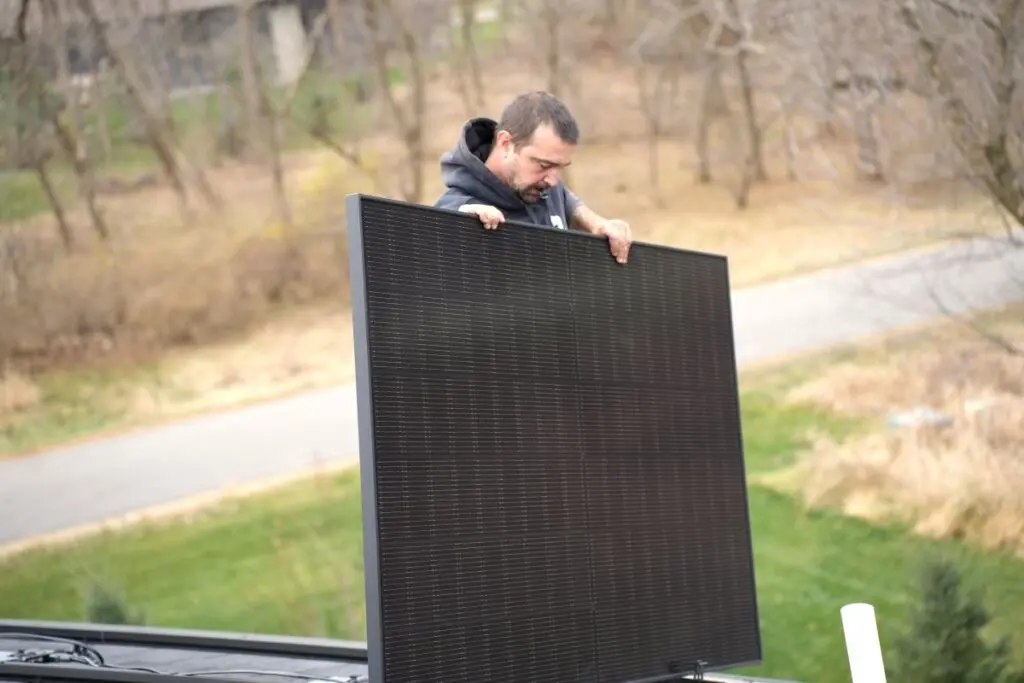 Badgerland Exteriors team installing solar panels