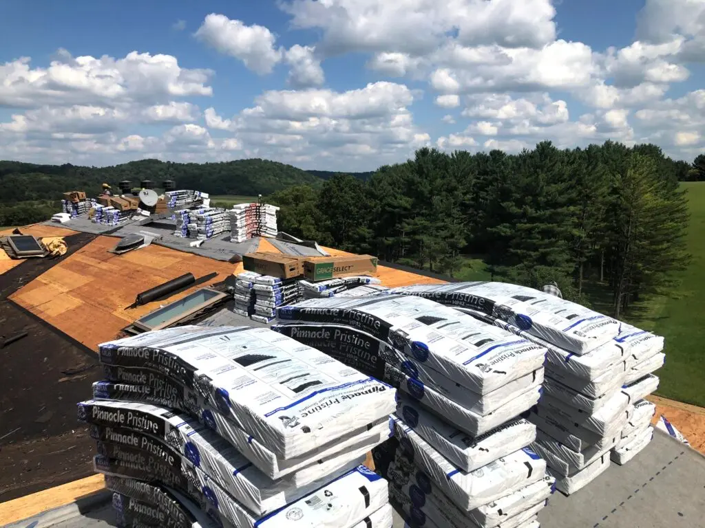 Stacks of roofing shingles and materials