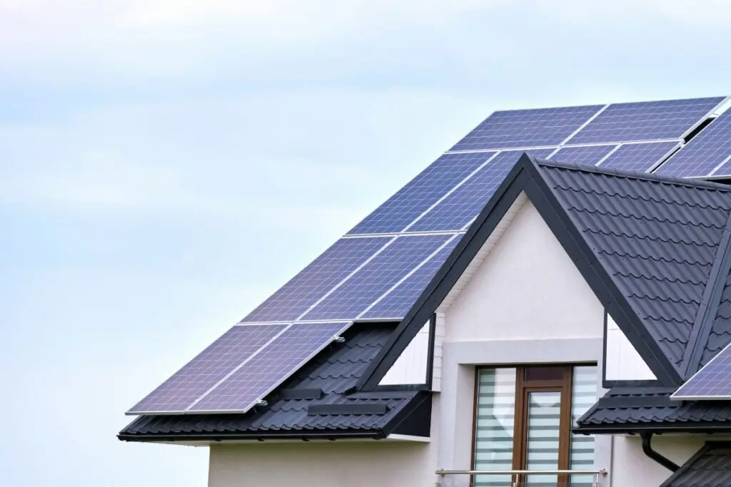 Residential house with rooftop covered with solar photovoltaic panels