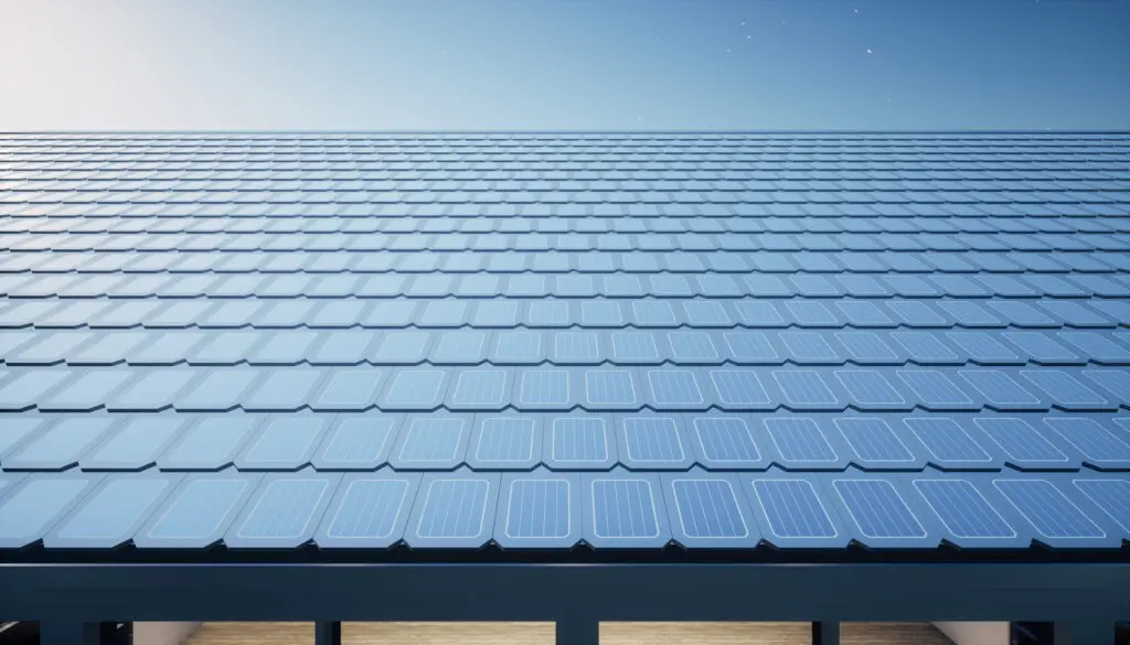 A modern rooftop covered with sleek, blue solar shingles under a clear sky, showcasing sustainable and energy-efficient building design with innovative solar technology.