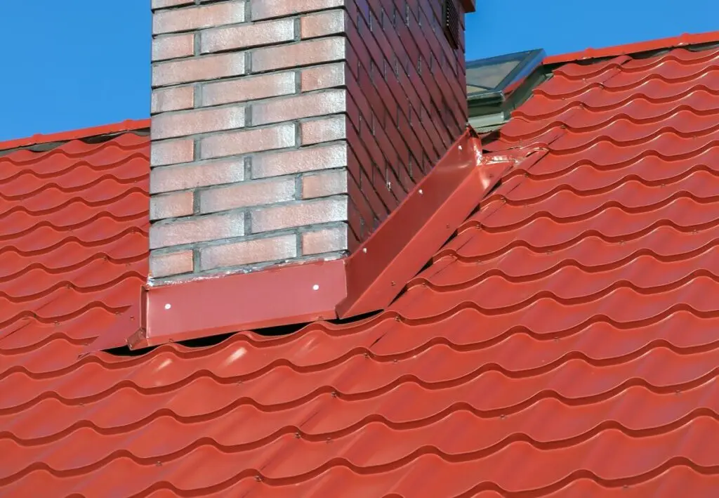 metal tile roof with a chimney and chimney flashing