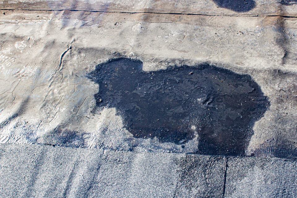 commercial flat roofing-close up of damaged roofing