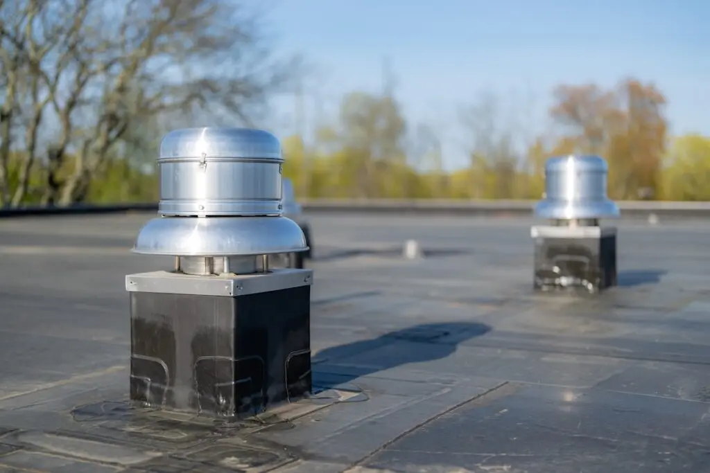 Photo of a roof exhaust ventilation fan on a new EPDM on a large commercial building
