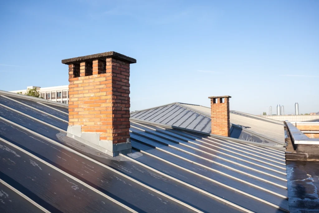 commercial roofing mcfarland large commercial building metal roof with chimneys