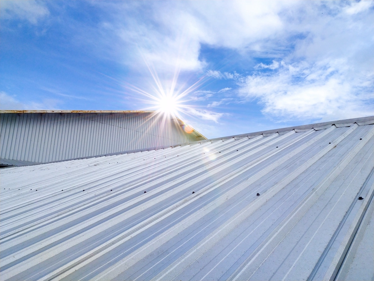 commercial roofing sun prairie sun shining over commercial building metal roof