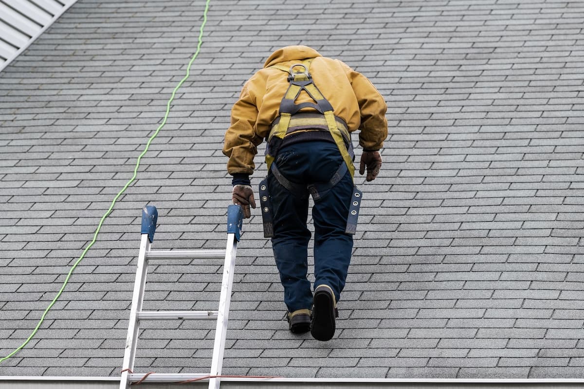 worker walking on roof during inspection
