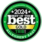 A circular emblem with a green border reads: "The Official Community Choice Awards." Central text states "2024 Best of the Best Gold" with "Trib Live" beneath. Bottom text in the border says "Allegheny East.