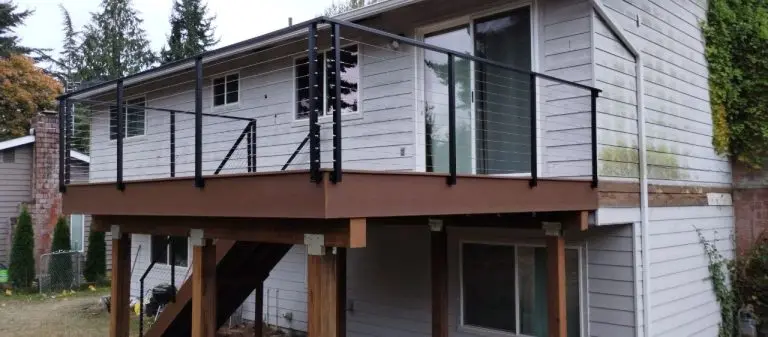 Ornamental iron fence around a porch