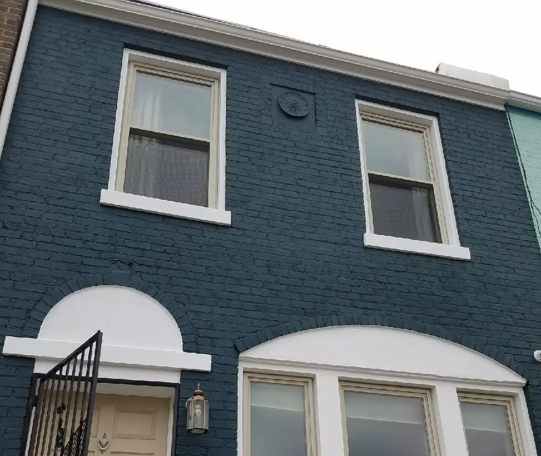 Brick exterior painted deep teal with white trim - Lorton, VA