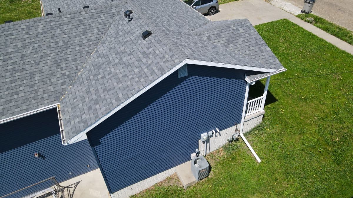 A blue house with a grey roof