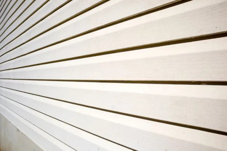 House with pale yellow vinyl siding, James Hardie Siding