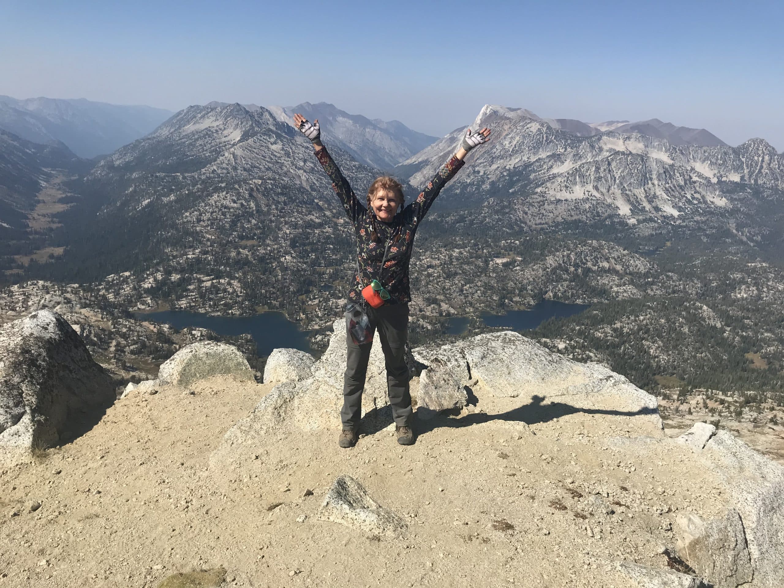 Susan Hart on top of a mountain