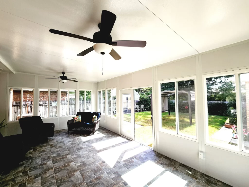 Bright sunroom interior with thermal break extrusions and quality door construction.